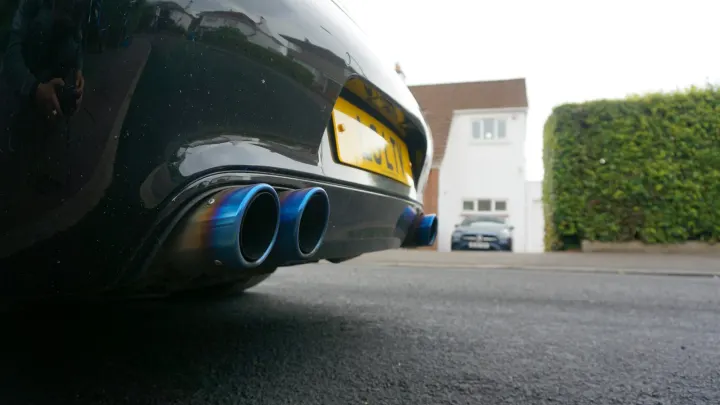 Close-up of blue exhaust pipes on a car